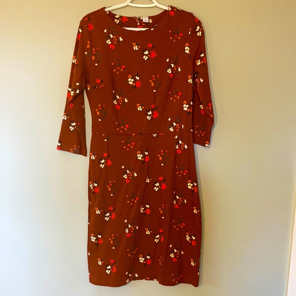 Rust color dress with floral pattern
